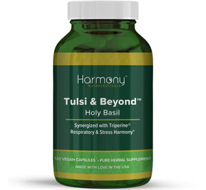 Green supplement bottle labeled 'Harmony Tulsi & Beyond' on a white background